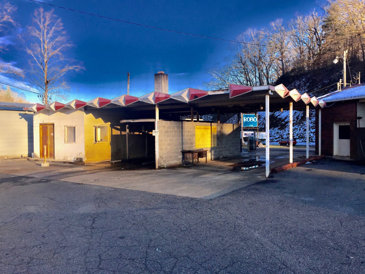 An outdoor vehicle washing facility