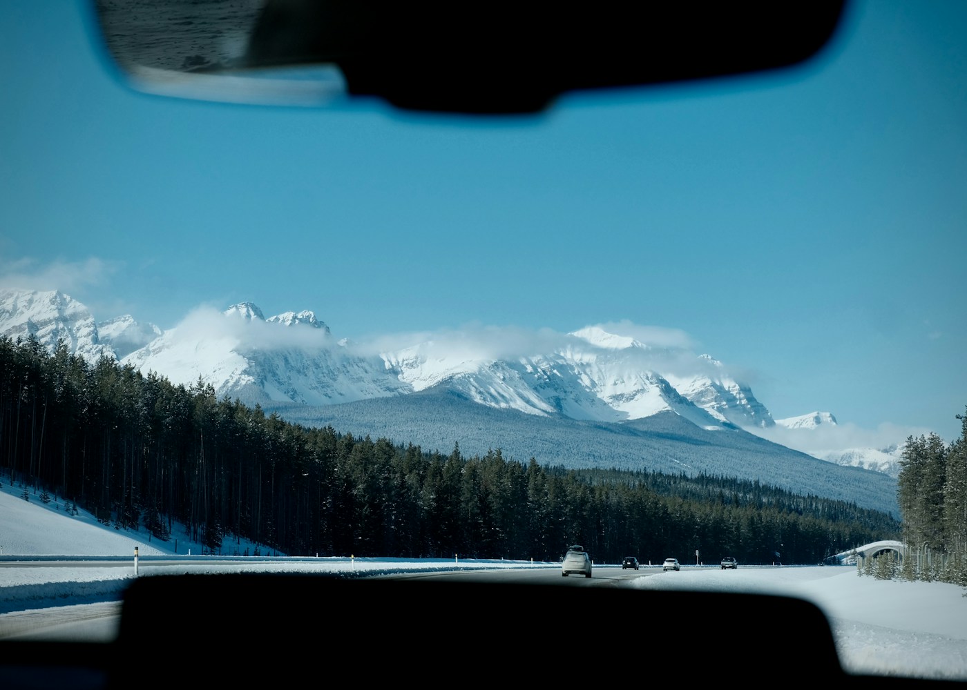 Mountain scenery seen from inside a car on a road trip